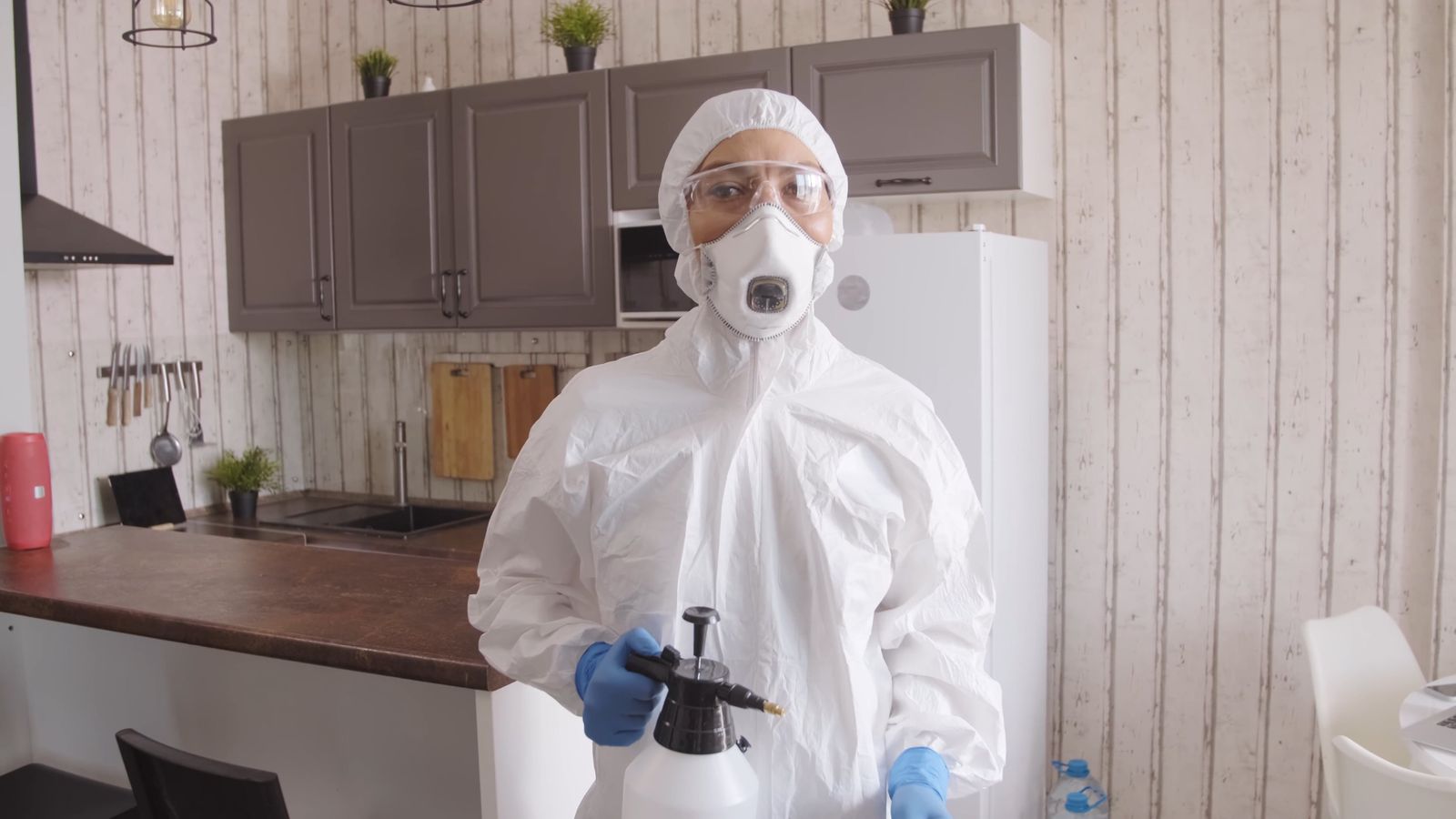Union Pest Control technician in protective kit